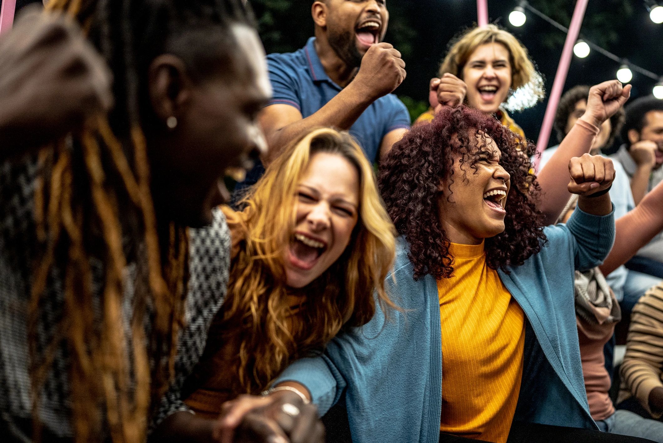 Parents cheering at a sports event