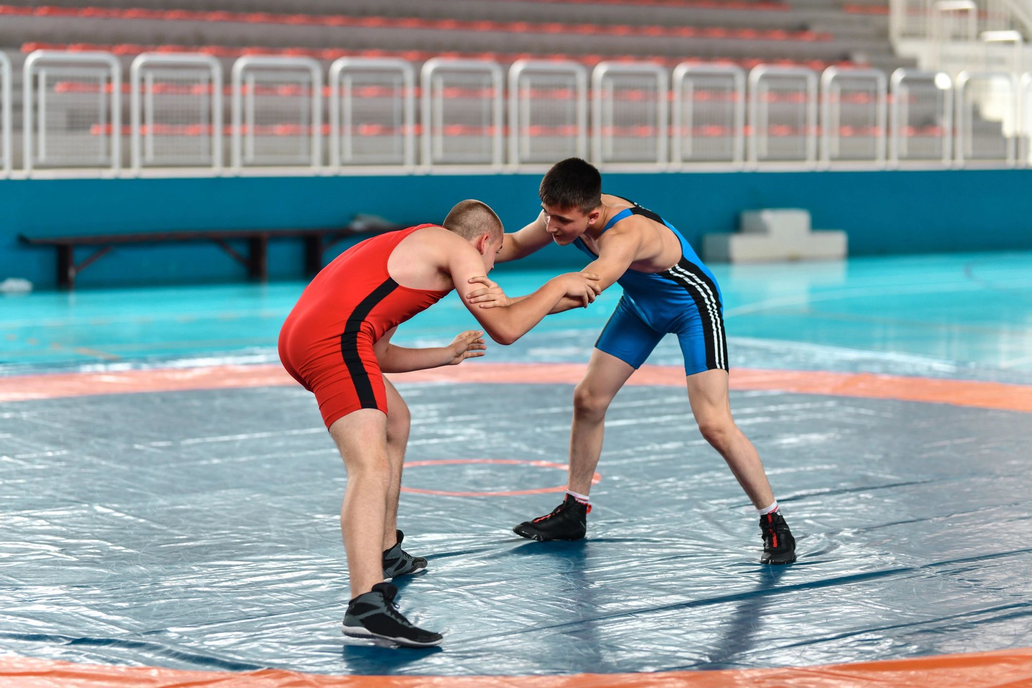 Two youth wrestlers competing in a match
